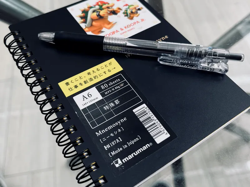 Notebook and pen.